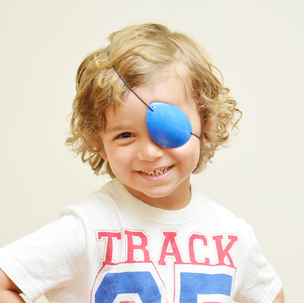 child wearing eye patch